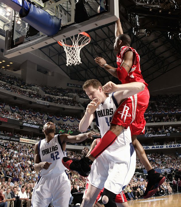 Tracy McGrady dunks on Shawn Bradley.